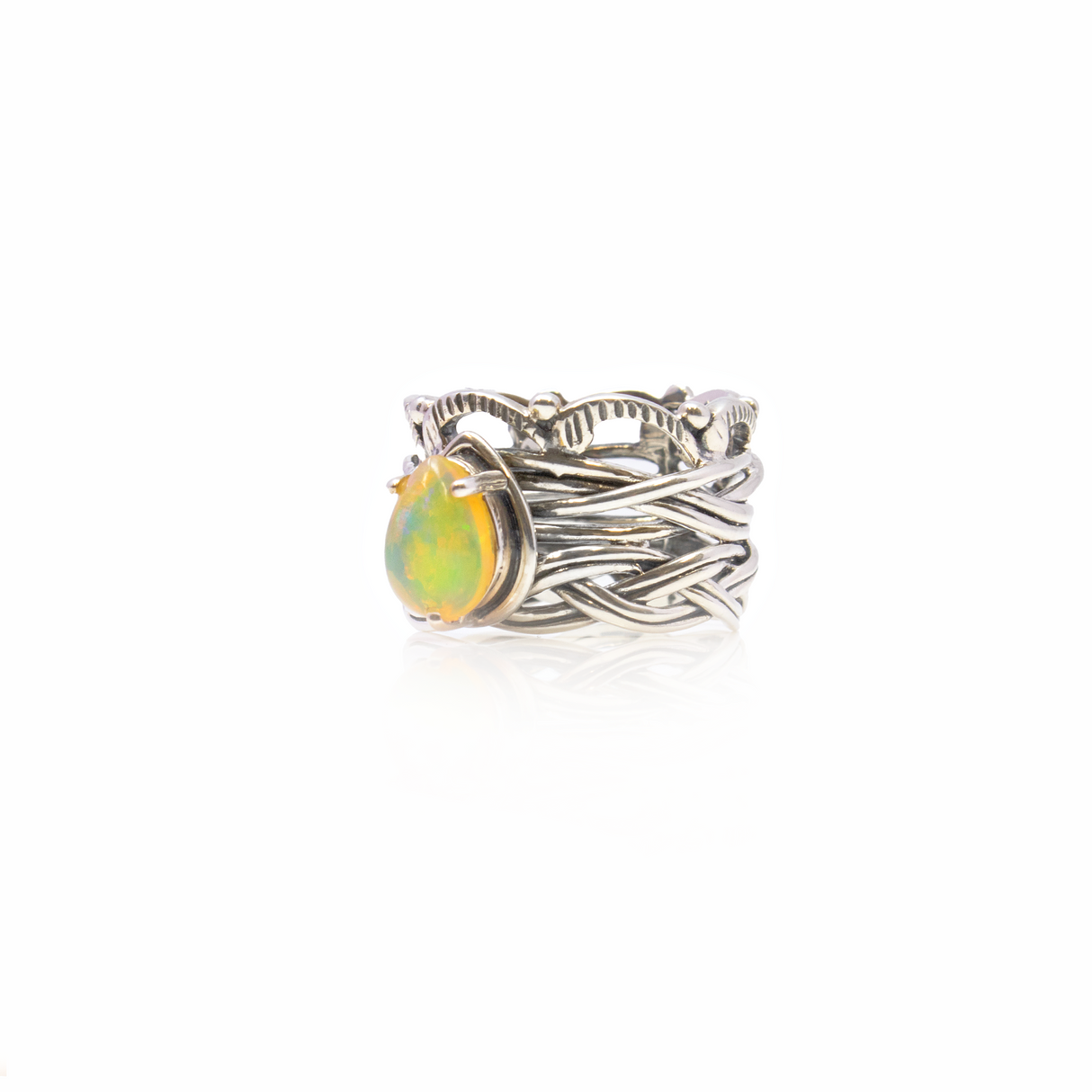 View of Ethiopian Opal Ring - Pear Cabochon Prong Set On 925 Sterling Silver Bezel With Braided & Vine Design Sz9