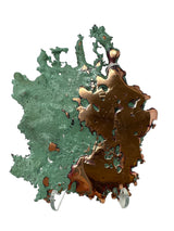 Michigan splash copper split between a green patina left side and polished copper right side