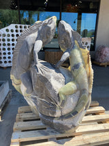 Green Talan Onyx iguana carving featuring two iguanas on a rock, showcasing intricate details and natural colors.