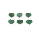 Six polished green fluorite hearts with a translucent glassy sheen arranged in two rows