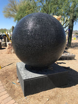 View of 60\" Diameter Black Casted Concrete Sphere Fountain - Extra Large
