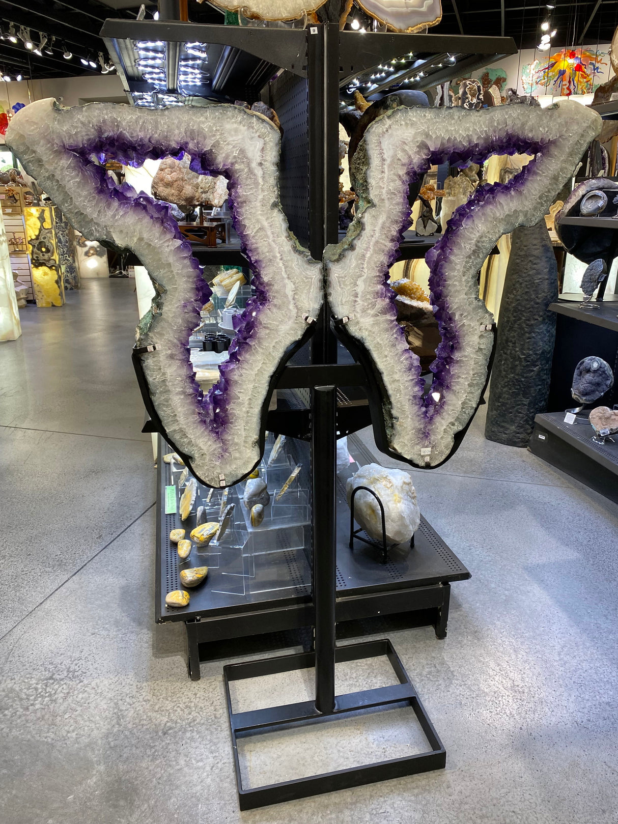 View of Amethyst Geode Ring Wing Pair in Fitted Stand with Open Base