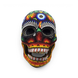 Rare Earth Gallery Huichol beaded skull with intricate colorful patterns and a functional moving jaw