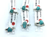 Polished freeform turquoise nugget rings in simple 925 sterling silver bezels and bands on display stands