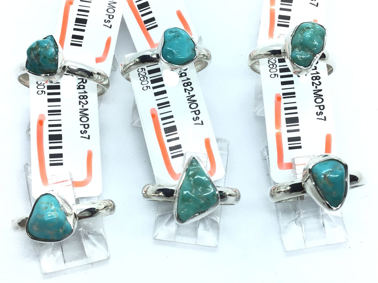 Sterling silver rings with polished freeform turquoise nuggets bezel-set on simple bands