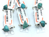 Sterling silver rings with polished freeform turquoise nuggets bezel-set on simple bands