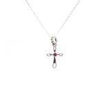 View of Faceted Ruby Pendant - Dainty 925 Sterling Silver (Rhodium Plated) Cross with Prong Set Round in Center & Cutout Edge