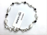 View of Howlite Link Bracelet - 6 Sharp Oval Cabochon with 5 Black Onyx Round Cabochons with 925 Sterling Silver Bezels