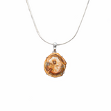 View of Madagascar Petrified Wood Pendant - Slice Prong Set with 925 Sterling Silver - Cream Center with Deep Sienna Edges