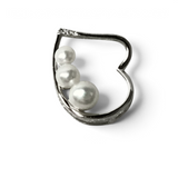 Rare Earth Gallery heart pendant featuring three graduated white freshwater pearls set in a polished silver frame