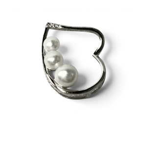 Rare Earth Gallery heart pendant featuring three graduated white freshwater pearls set in a polished silver frame