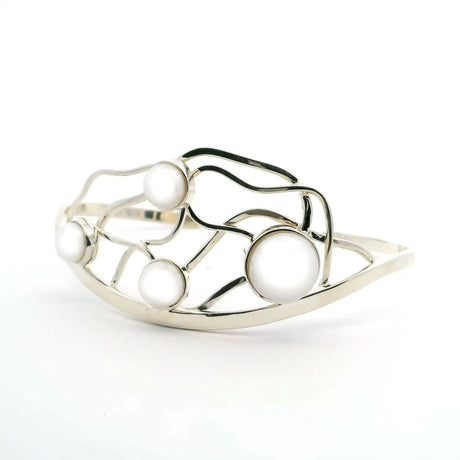 View of Freshwater Pearl Cuff - 4 Round Pearls Bezel Set in 925 Sterling Silver on Curved Cuff with Wavy Lines