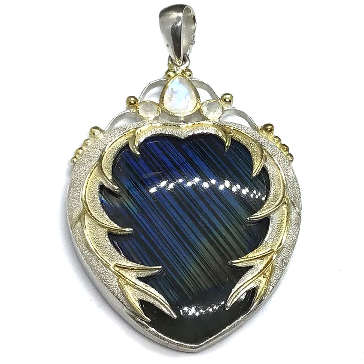 View of Labradorite Pendant - Blue with Yellow Flash Cabochon Bezel Set in 925 Sterling Silver Sandblasted Heart Setting with Gold Plating & Faceted Moonstones Above