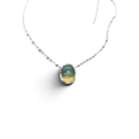 Rare Earth Gallery oval Ethiopian opal cabochon necklace in a 925 sterling silver slider bezel with an 18-inch chain.