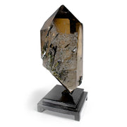 Smoky quartz point with green tourmaline and clear crystal inclusions on one face, on black stand