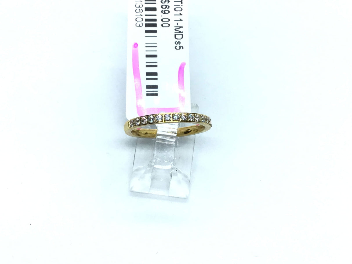 Slim gold-tone titanium ring pave-set with white cubic zirconia across the top half