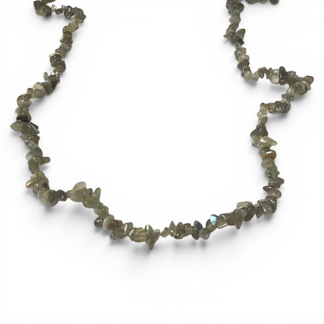 Necklace made of small, irregularly shaped labradorite stones on a white background