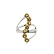 View of Citrine Ring - 7 Faceted Rounds in S-Shaped Design on Triple Band Prong Set in 925 Sterling Silver sz8