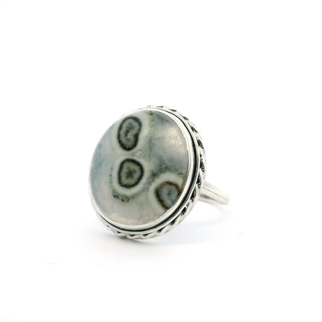 View of Solar Quartz Stalactite Ring - Round Cabochon with Gray Background & 3 Eyes with White & Dark Brown Banding Bezel Set with Rope Detail in 925 Sterling Silver sz9