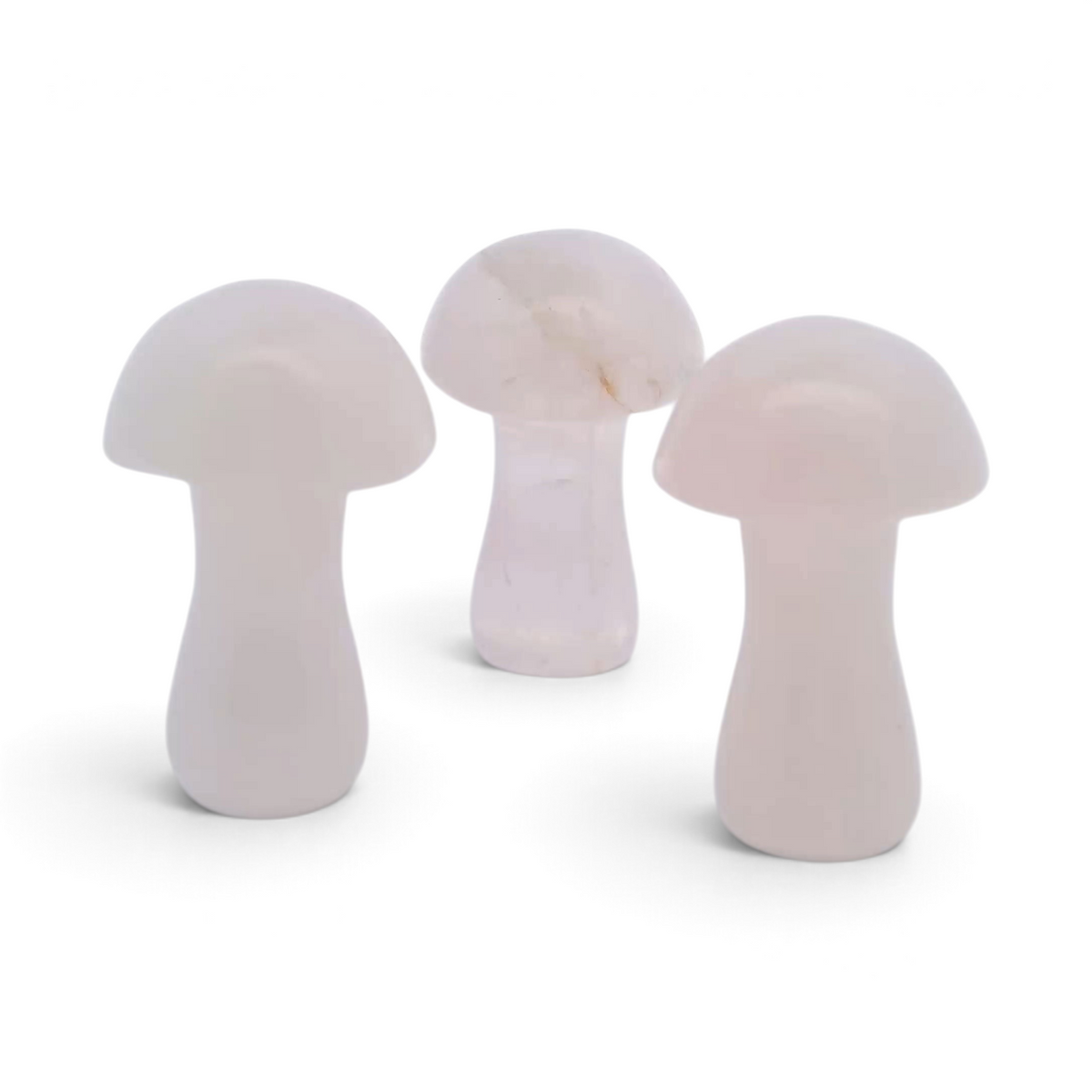 Three pale pink rose quartz mushroom carvings about 1 inch tall