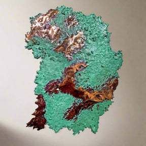 Copper splash with green and brown textures on a white background