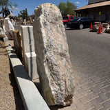Ice onyx and caliche vertical fountain standing in the gallery yard, white druze face beside tan caliche side