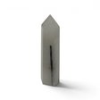 Black tourmaline in quartz crystal tower, milky white polished point with one slender dark tourmaline blade