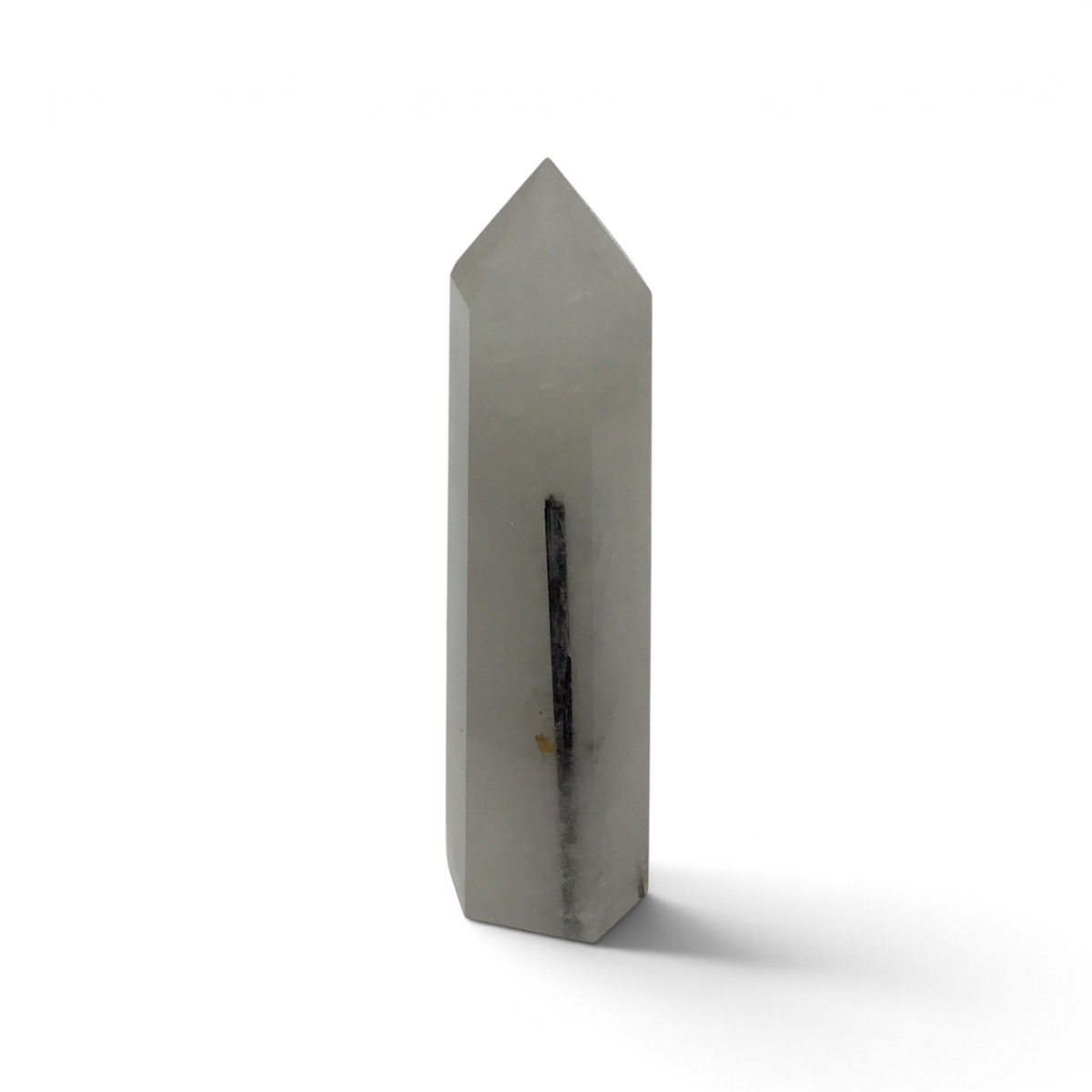 Black tourmaline in quartz crystal tower, milky white polished point with one slender dark tourmaline blade