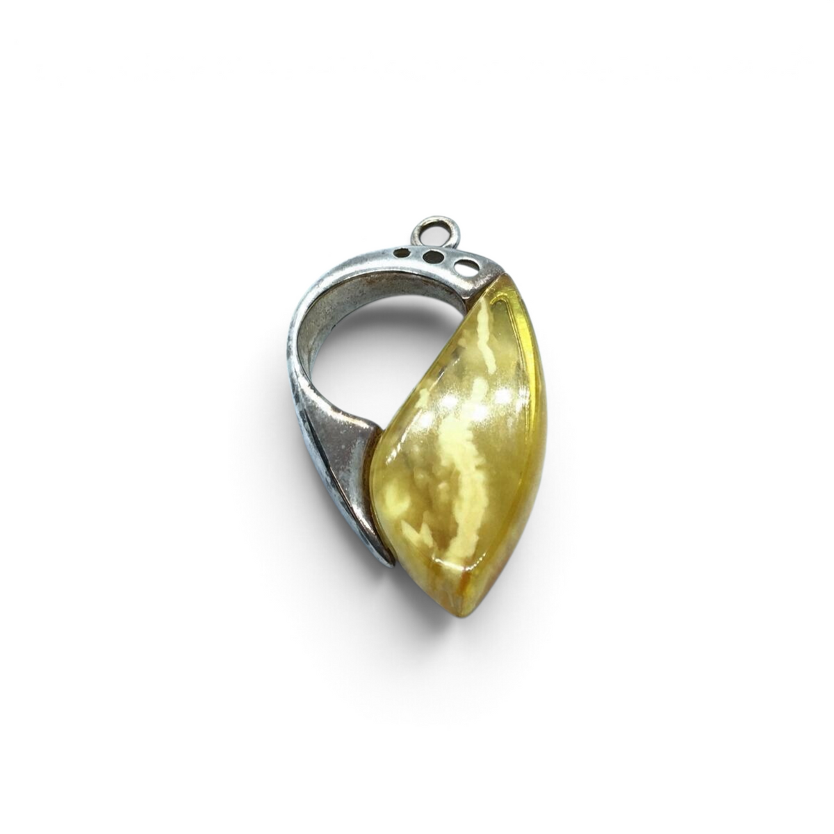 Rare Earth Gallery butterscotch amber freeform pendant set in silver with a half circle and three round cutouts