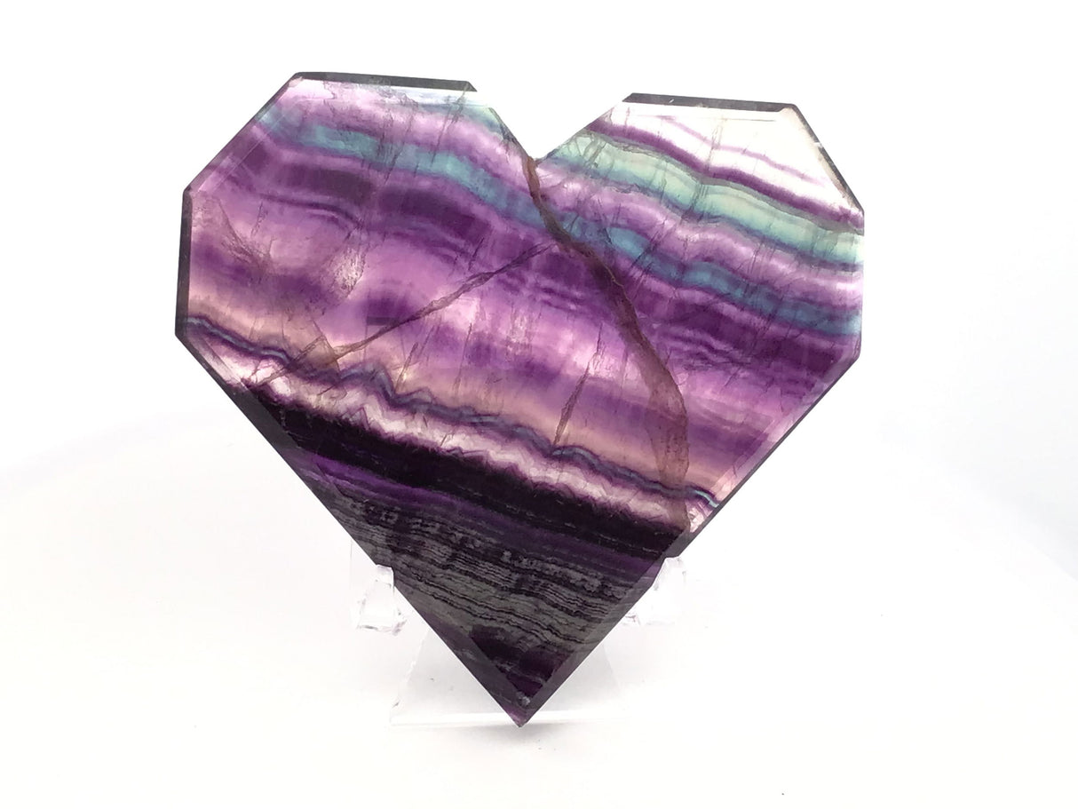 Rainbow Fluorite Heart - Flat with Faceted Faces on Lucite Stand (Diagonal Purple & Green & Clear Banding with Opaque Stripes at Tip)