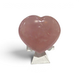 Rose quartz puffy heart with soft pink translucence on a clear display stand