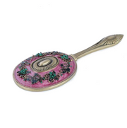 Pink Jewel Mirror handheld vanity mirror with pink enamel, antiqued brass scrollwork and green crystals