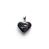Rare Earth Gallery dainty heart pendant featuring a native copper cabochon in a rhodium plated sterling silver bezel.