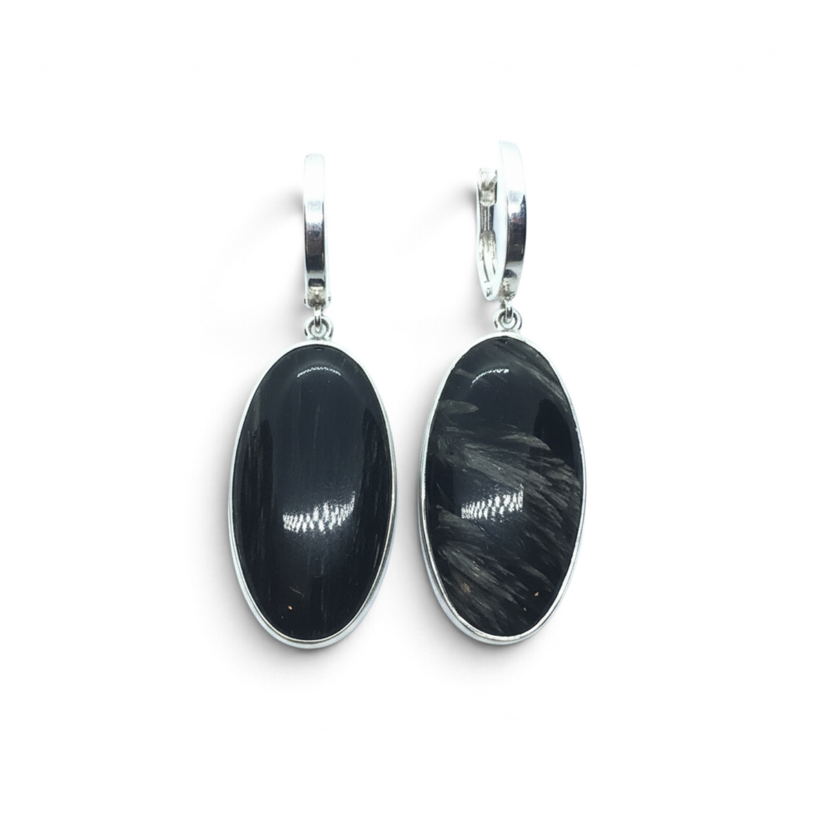 Rare Earth Gallery oval golden seraphinite dangle earrings featuring a polished silver bezel and secure lever back.