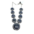 Graduated blue lapis lazuli cabochons haloed with marcasite and Swarovski crystal pave on silver chain
