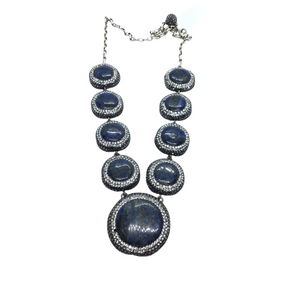 Graduated blue lapis lazuli cabochons haloed with marcasite and Swarovski crystal pave on silver chain