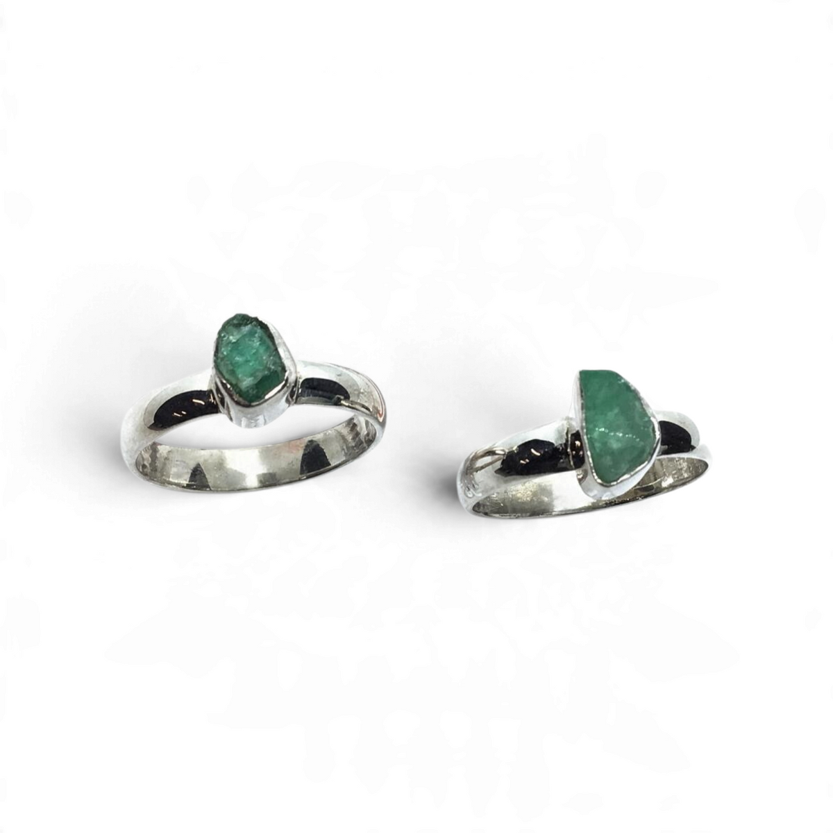 Rare Earth Gallery emerald ring featuring a rough freeform green gemstone set in a tall polished silver bezel