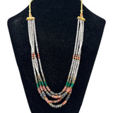 Multi corundum multi-strand beaded necklace with ruby, emerald, sapphire and clear quartz beads on a bust