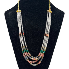 Multi corundum multi-strand beaded necklace with ruby, emerald, sapphire and clear quartz beads on a bust