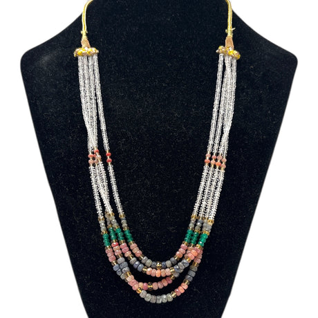 Multi corundum multi-strand beaded necklace with ruby, emerald, sapphire and clear quartz beads on a bust