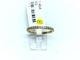 Yellow gold IP plated titanium band with white CZ pave along half of the 2mm ring
