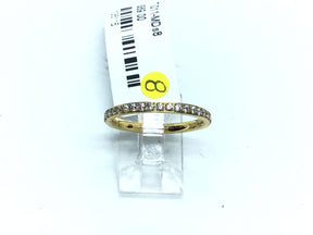 Yellow gold IP plated titanium band with white CZ pave along half of the 2mm ring