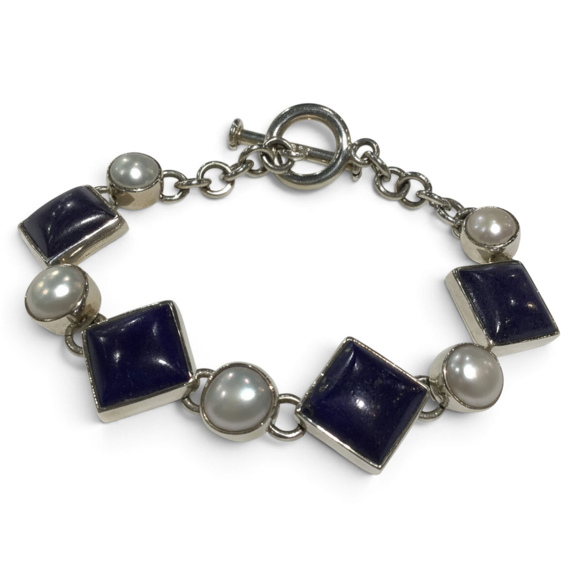 Rare Earth Gallery link bracelet featuring square lapis lazuli stones and round white pearls with a toggle clasp.