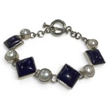 Rare Earth Gallery link bracelet featuring square lapis lazuli stones and round white pearls with a toggle clasp.