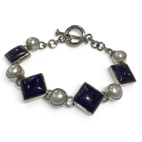 Rare Earth Gallery link bracelet featuring square lapis lazuli stones and round white pearls with a toggle clasp.