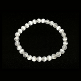 Rare Earth Gallery 6mm selenite beaded bracelet with translucent white crystal beads on a white background