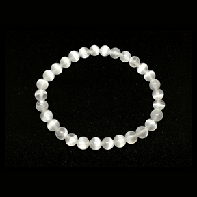 Rare Earth Gallery 6mm selenite beaded bracelet with translucent white crystal beads on a white background