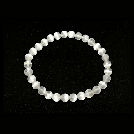 Rare Earth Gallery 6mm selenite beaded bracelet with translucent white crystal beads on a white background