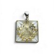 Rare Earth Gallery quartz pyramid pendant in 925 sterling silver with a gold plated mandala accent and simple bail.