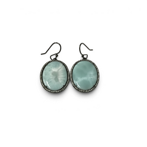 Rare Earth Gallery oval larimar dangle earrings with Swarovski crystal bezels and black ruthenium overlay.